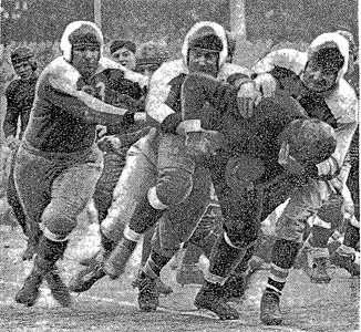 Giants wrestle down Nagurski.